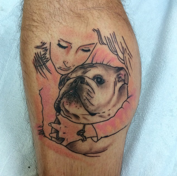 Bulldog and her owner tattoo on arm
